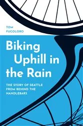 Book cover of Biking Uphill in the Rain by Tom Fucoloro