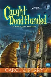 Book cover of Caught Dead Handed by Carol J. Perry