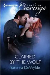 Book cover of Claimed by the Wolf by Saranna DeWylde