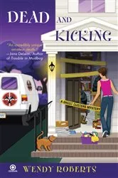 Book cover of Dead and Kicking by Wendy Roberts