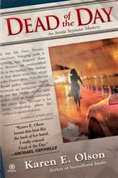 Book cover of Dead of the Day by Karen E. Olson