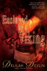 Book cover of Enslaved by a Viking by Delilah Devlin