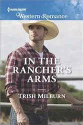 Book cover of In the Rancher's Arms by Kathie DeNosky