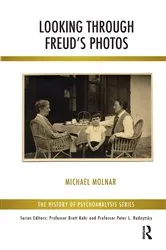 Book cover of Looking Through Freud's Photos by Michael Molnar