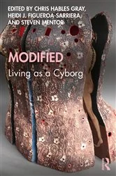 Book cover of Modified: Living as a Cyborg by Chris Hables Gray