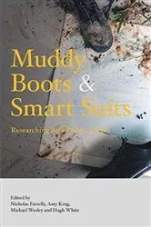 Book cover of Muddy Boots and Smart Suits by Nicholas Farrelly