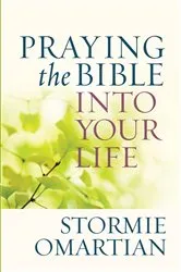 Book cover of Praying the Bible into Your Life by Stormie Omartian