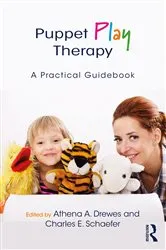 Book cover of Puppet Play Therapy by Athena A. Drewes
