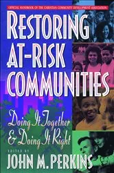 Book cover of Restoring At-Risk Communities by John M. Perkins
