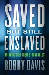 Book cover of Saved but Still Enslaved by Bobby Davis