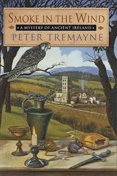 Book cover of Smoke in the Wind by Peter Tremayne