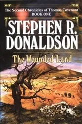 Book cover of The Wounded Land by Stephen R. Donaldson