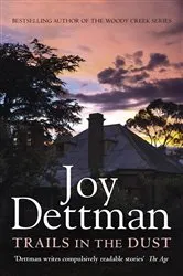 Book cover of Trails in the Dust: A Woody Creek Novel 7 by Joy Dettman